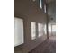 High-ceiling living room with multiple windows and carpet at 3608 Tundra Swan St, Las Vegas, NV 89122