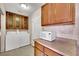 Laundry room with washer, dryer, and cabinets at 5290 Obannon Dr, Las Vegas, NV 89146