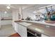 White kitchen with view into the dining area at 5290 Obannon Dr, Las Vegas, NV 89146