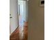 Clean and bright hallway with tile floors at 5607 W Dewey Dr, Las Vegas, NV 89118