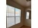 Bright living room with large windows and tile floors at 5607 W Dewey Dr, Las Vegas, NV 89118