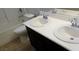 Bathroom with double sinks, a bathtub, and toilet at 9033 Savvy Seam Ct, Las Vegas, NV 89149