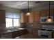 Spacious kitchen with granite countertops and wood cabinets at 9076 Quarrystone Way, Las Vegas, NV 89123