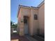 Two-story house exterior with a front entrance and walkway at 9076 Quarrystone Way, Las Vegas, NV 89123