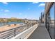 Balcony with lake and community views, spiral staircase, and modern railing at 14 Heron Harbour Dr, Henderson, NV 89011