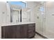 Modern bathroom with a glass shower and dark vanity at 14 Heron Harbour Dr, Henderson, NV 89011