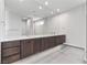 Modern bathroom with double vanity and large mirror at 14 Heron Harbour Dr, Henderson, NV 89011