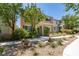 Two-story home, front yard view with landscaping at 9144 Ebony Threads Ct, Las Vegas, NV 89149