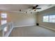 Spacious bedroom with ceiling fan and neutral carpeting at 9144 Ebony Threads Ct, Las Vegas, NV 89149