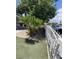 Front yard with palm trees and a white fence at 2932 Demetrius Ave, Las Vegas, NV 89101