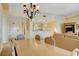 Bright dining room with a large table and kitchen views at 30 Strada Di Villaggio # 204, Henderson, NV 89011