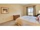 Bedroom with a king-size bed and a view at 30 Strada Di Villaggio # 204, Henderson, NV 89011