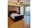 Spacious bedroom with hardwood floors and balcony access at 200 W Sahara Ave # 810, Las Vegas, NV 89102