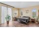 Main bedroom with a large bed, sliding glass doors, and wood floors at 3508 Discovery Downs Ct, North Las Vegas, NV 89081