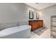 Elegant bathroom with double sinks and a large tub at 4525 Dean Martin Dr # 1208, Las Vegas, NV 89103