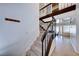 Bright foyer with tiled floors, stairs leading to a loft, and open doorway at 7244 Bridgeview Ave, Las Vegas, NV 89147