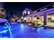 Stunning pool with fire pit and spa at night at 4181 Bronze Ridge St, Las Vegas, NV 89135