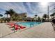 Relaxing pool area with red lounge chairs at 8255 S Las Vegas Blvd # 1015, Las Vegas, NV 89123