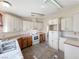 Bright kitchen with ample cabinetry and tile flooring at 4850 Pontiac Cir, Pahrump, NV 89048