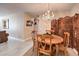 Bright dining area with a wooden table and chandelier at 1375 E Hacienda Ave # 114, Las Vegas, NV 89119