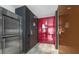 Modern entryway with sleek dark wood and red doors at 4381 W Flamingo Rd # 20320, Las Vegas, NV 89103