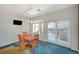 Dining area with a wooden table, four chairs, and sliding glass doors at 1420 Logandale Dr, Logandale, NV 89021