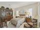 Comfortable bedroom with built-in shelving and seating area at 10057 Regency Canyon Way, Las Vegas, NV 89148