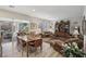 Open concept dining area with wooden table and access to patio at 10057 Regency Canyon Way, Las Vegas, NV 89148