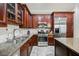 Modern kitchen with stainless steel appliances and island at 19 Via Visione # 102, Henderson, NV 89011