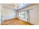 Well-lit bedroom with large window and ceiling fan at 7952 Song Thrush St, North Las Vegas, NV 89084