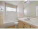 Clean bathroom featuring a bathtub, toilet, and vanity with a mirror at 5051 Jacarilla Ln, North Las Vegas, NV 89031