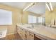 Double vanity bathroom with large mirror and tile at 5051 Jacarilla Ln, North Las Vegas, NV 89031