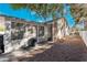 View of backyard with gravel and partially covered patio at 2086 Angel Falls Dr, Henderson, NV 89074