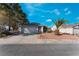 Single story house with attached garage and palm tree at 2086 Angel Falls Dr, Henderson, NV 89074