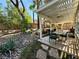 Landscaped backyard with pergola and patio furniture at 198 Adomeit Dr, Henderson, NV 89074