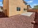 Landscaped backyard with gravel and a concrete patio at 10843 Leatherstocking Ave, Las Vegas, NV 89166