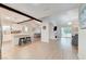 Modern kitchen with white cabinets, island, and stainless steel appliances at 6771 Shelter Ln, Las Vegas, NV 89103