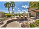 Outdoor bar with seating, nestled in a landscaped backyard at 3130 Appleblossom Cir, Las Vegas, NV 89117