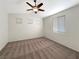 Main bedroom with neutral carpeting and a ceiling fan at 8473 Bellery Ave, Las Vegas, NV 89143