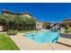 Relaxing pool area with lush landscaping and spacious patio at 6391 Tempting Choice Ave, Las Vegas, NV 89131