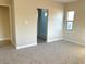 Primary bedroom with en-suite bathroom and carpet flooring at 4701 E Sandalwood Dr, Pahrump, NV 89061