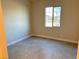 Simple bedroom with tile flooring and a window at 4701 E Sandalwood Dr, Pahrump, NV 89061