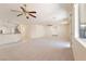 Open living room with high ceilings and neutral carpeting at 3589 Cottage Canyon St, Laughlin, NV 89029