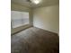 Well-lit bedroom featuring carpeted floors at 6709 Brick House Ave, Las Vegas, NV 89122