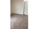 Simple bedroom with carpeted floor and an open door at 970 Flapjack Dr, Henderson, NV 89014