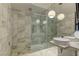 Spa-like bathroom with marble tile, walk-in shower, and double vanity at 4381 W Flamingo Rd # 1809, Las Vegas, NV 89103