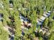 Secluded home surrounded by trees, seen from an aerial view at 2130 Via Spes Nostra St, Mount Charleston, NV 89124