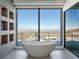 Spa-like bathroom with a soaking tub and scenic view at 25 Rockstream Dr, Henderson, NV 89012