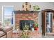 Brick fireplace with decorative mantel and hearth at 7400 Amigo St, Las Vegas, NV 89123