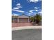 Single story home with three car garage and desert landscaping at 2873 Knoxville Ct, Henderson, NV 89052